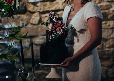 bride holding wedding cake